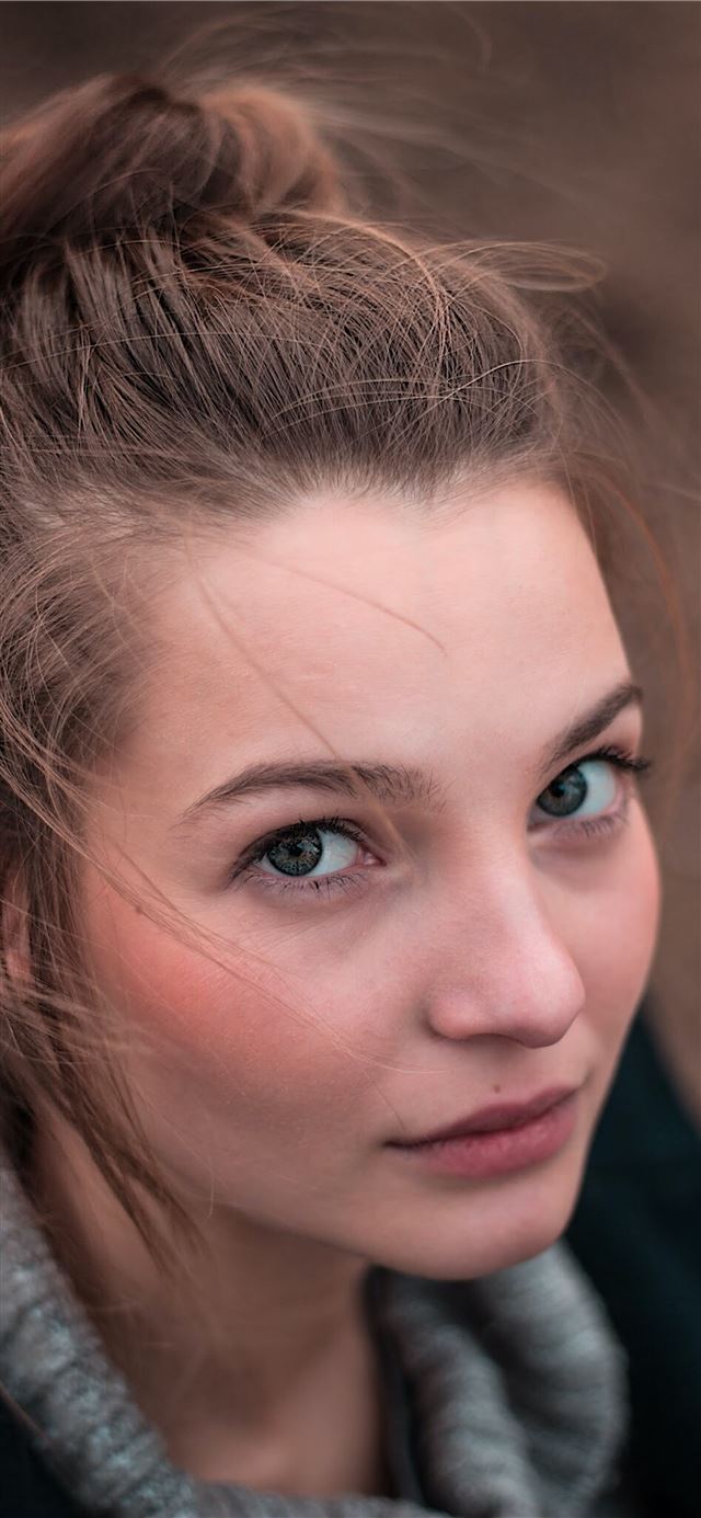 shallow focus photo of woman face iPhone 8 wallpaper 