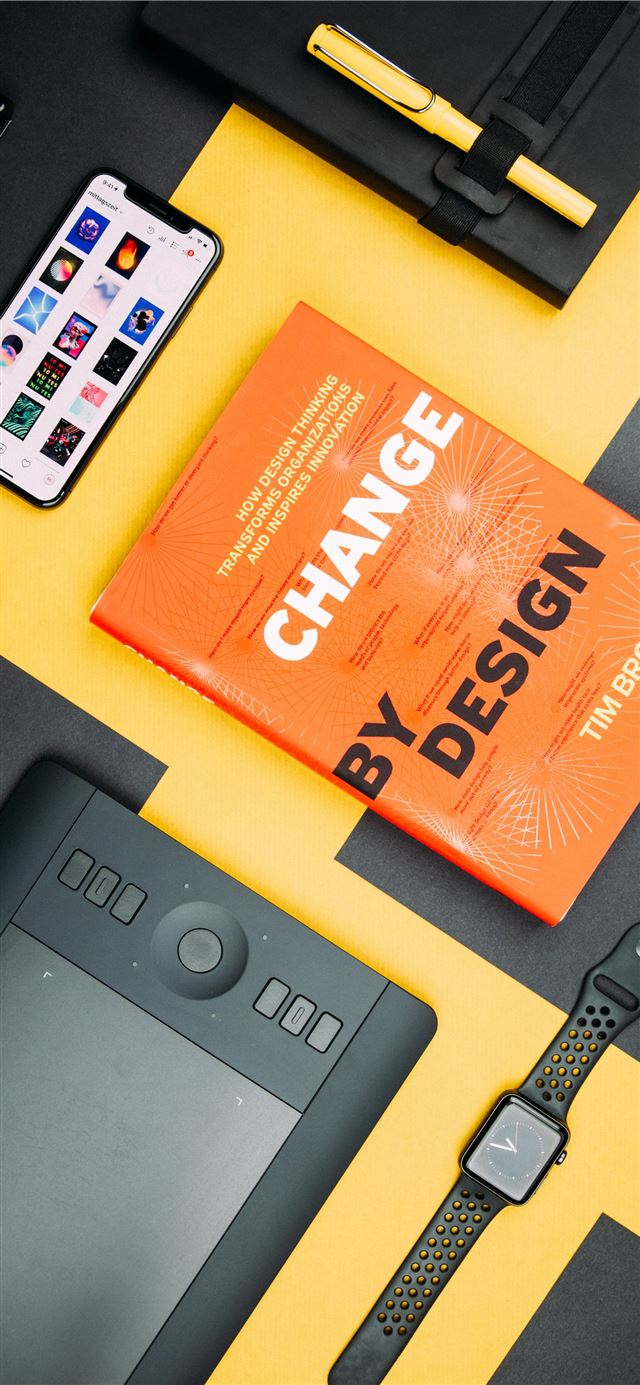 Change by Design by Tim Brown book beside smartpho... iPhone 11 wallpaper 