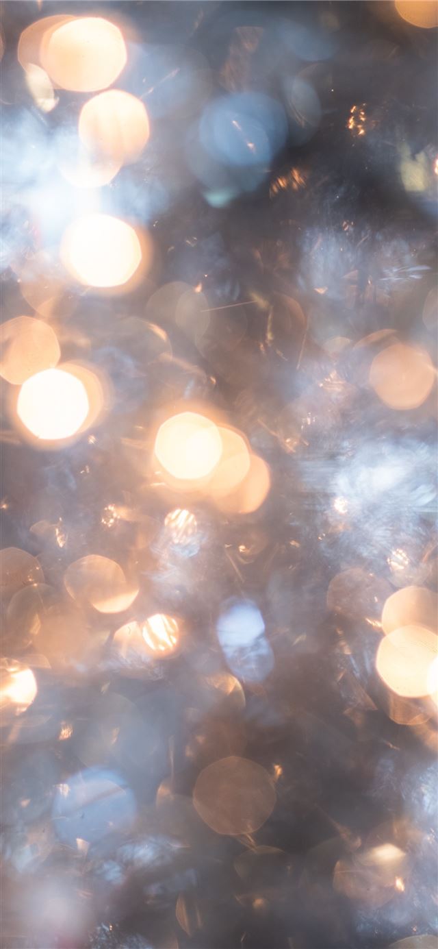 Christmas Bokeh Tinsel Tree with Holiday White Lig... iPhone 11 wallpaper 