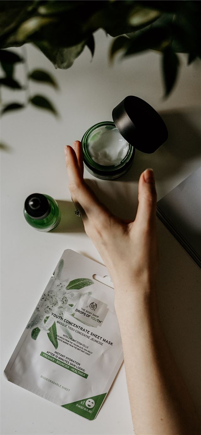person touching black plastic bottle iPhone 11 wallpaper 