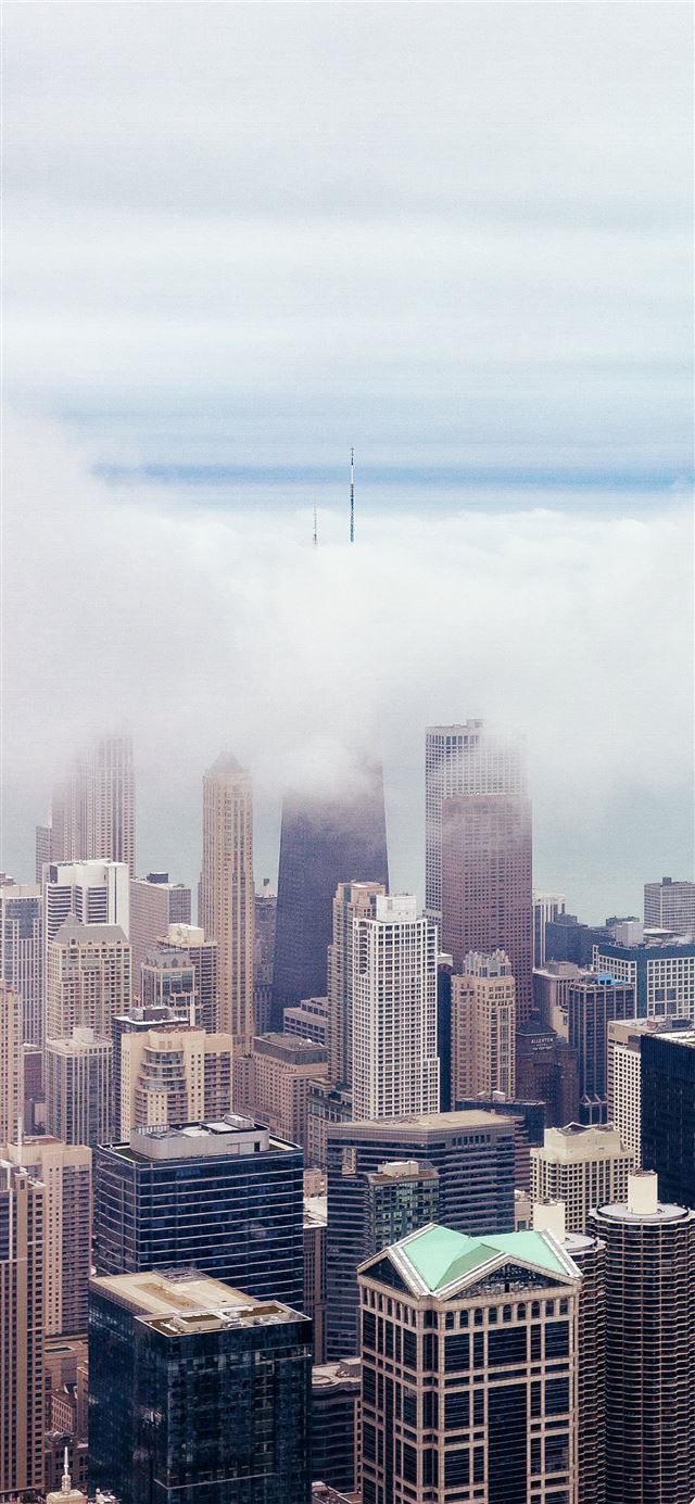 skyscrapers under cloudy sky iPhone 11 wallpaper 