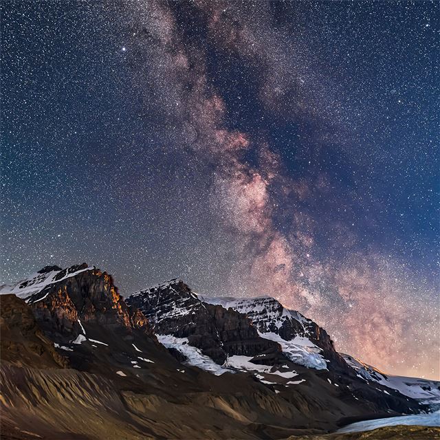 milky way and galactic core area over mount androm... iPad wallpaper 